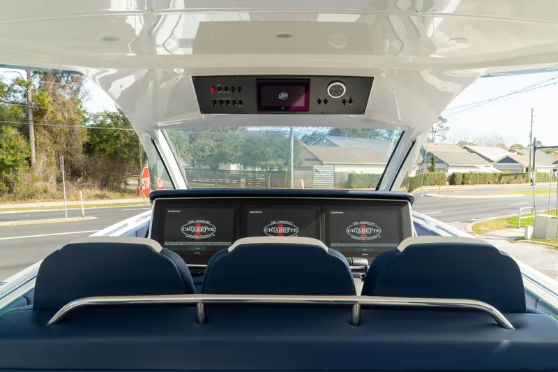  Yacht Photos Pics 2023 Cigarette 41' Nighthawk boat cockpit with advanced navigation screens and controls.