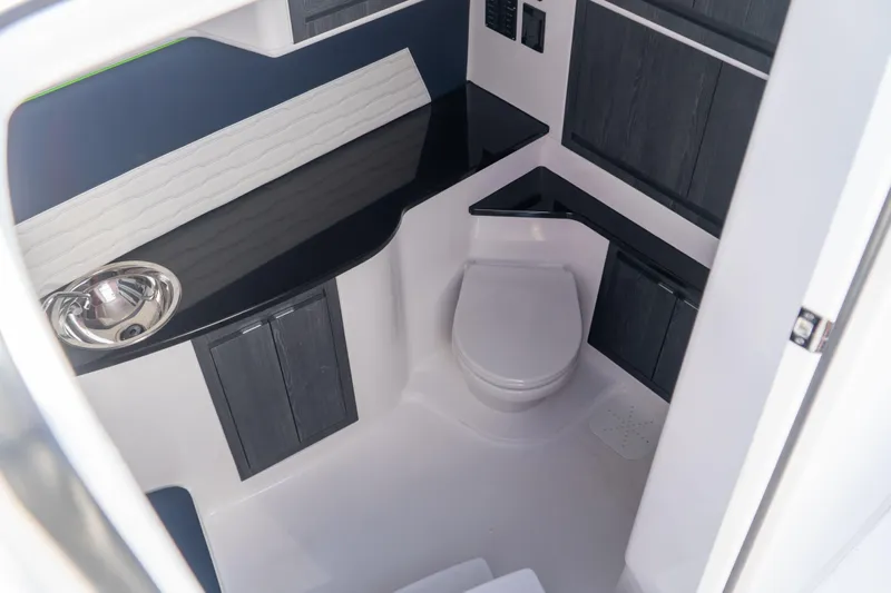  Yacht Photos Pics 2023 Cigarette 41' Nighthawk boat interior bathroom with modern sink and toilet.