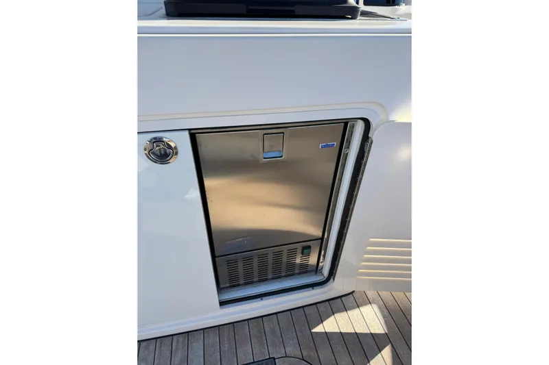 Dot's Deal Yacht Photos Pics Stainless steel refrigerator on 2023 Sabre 48 Salon Express yacht deck.