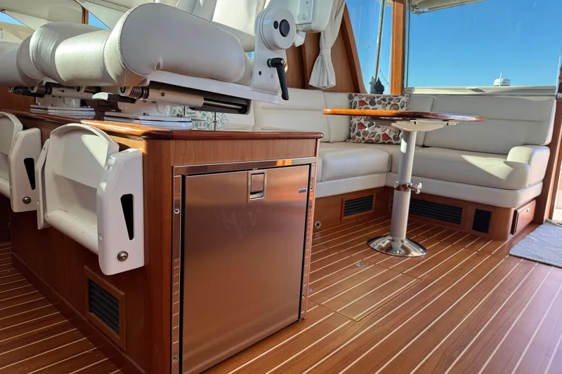 Dot's Deal Yacht Photos Pics 2023 Sabre 48 Salon Express interior with luxurious seating and wooden flooring.
