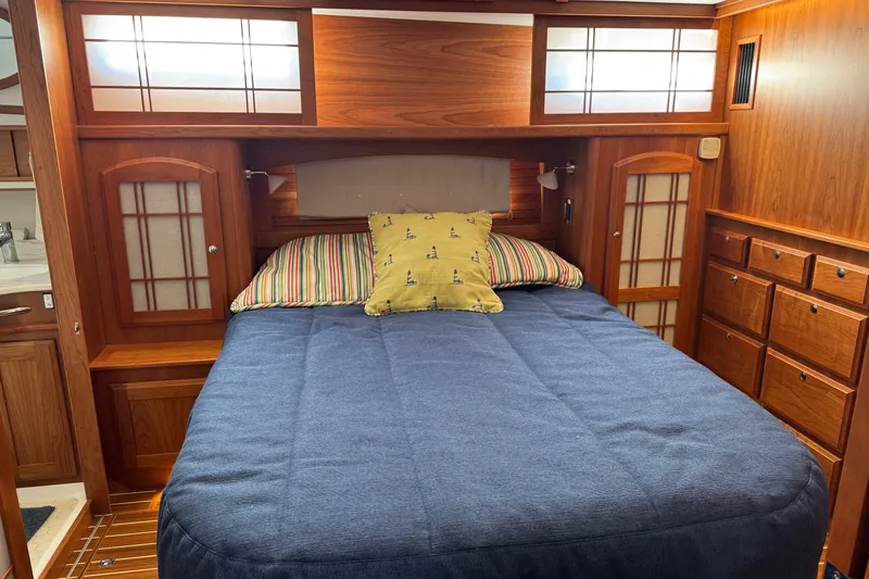 Dot's Deal Yacht Photos Pics Luxurious cabin interior of 2023 Sabre 48 Salon Express yacht with wooden furnishings.