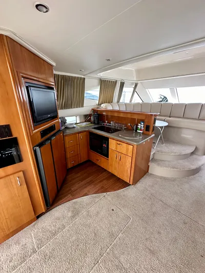  Yacht Photos Pics Interior of 2006 Carver 38 Super Sport yacht with modern kitchen and seating area.