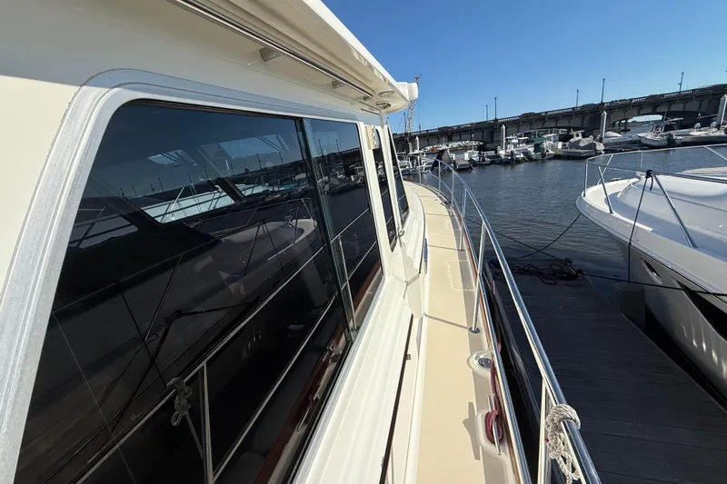 Haggis Xx Yacht Photos Pics 2017 Sabre 48 Salon Express yacht docked, showcasing sleek design and reflective windows.