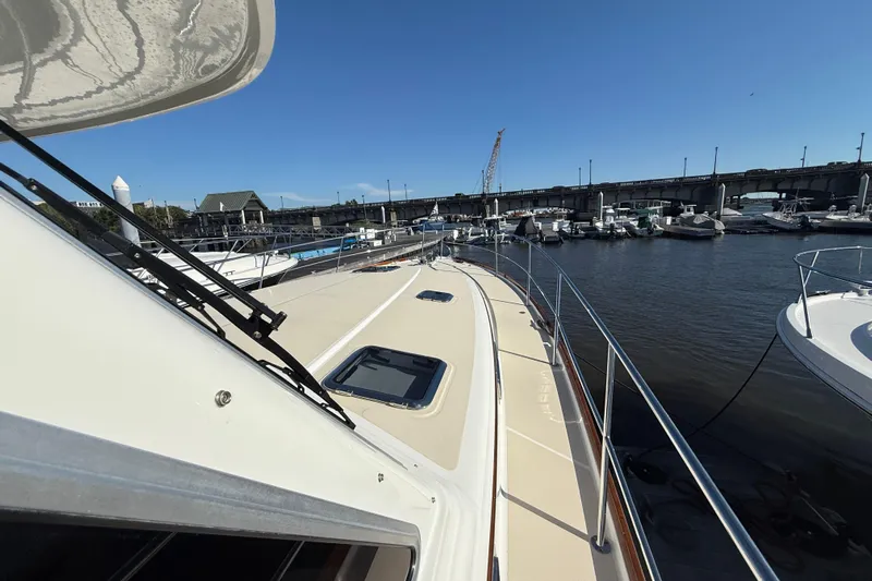Haggis Xx Yacht Photos Pics 2017 Sabre 48 Salon Express yacht docked at marina under clear blue sky.