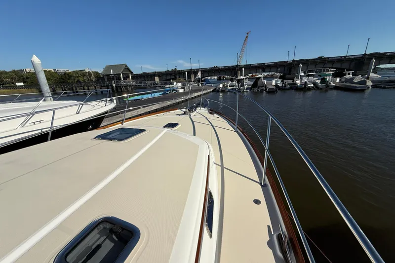 Haggis Xx Yacht Photos Pics 2017 Sabre 48 Salon Express yacht docked at marina with bridge in background.
