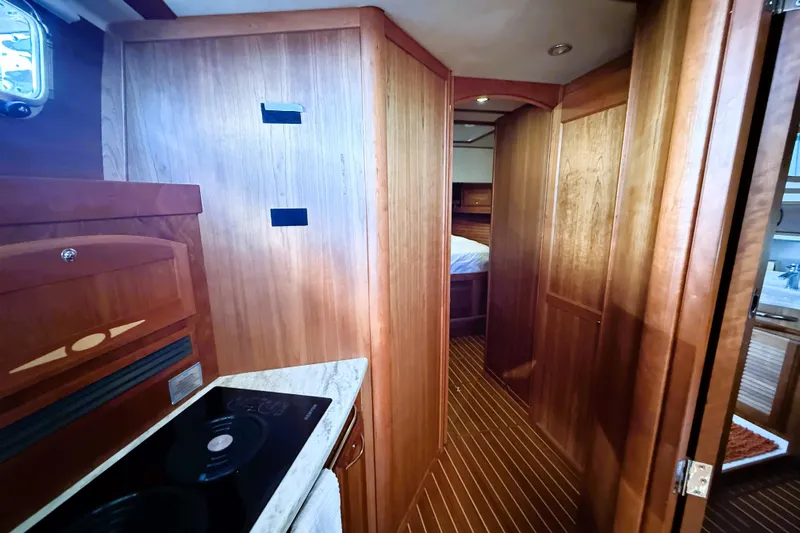 Haggis Xx Yacht Photos Pics Interior of 2017 Sabre 48 Salon Express yacht with wooden cabinetry and modern amenities.