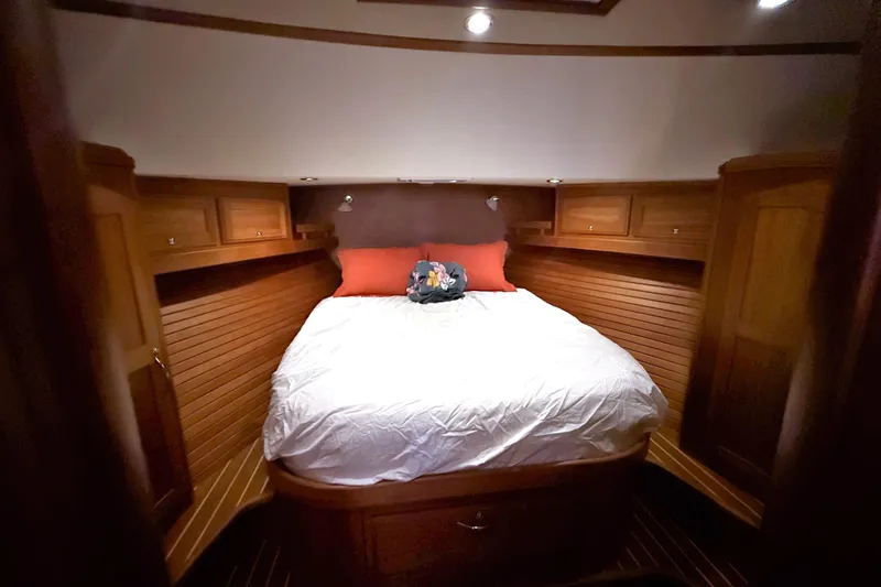 Haggis Xx Yacht Photos Pics Luxurious cabin interior of 2017 Sabre 48 Salon Express yacht with cozy bed and wooden finish.