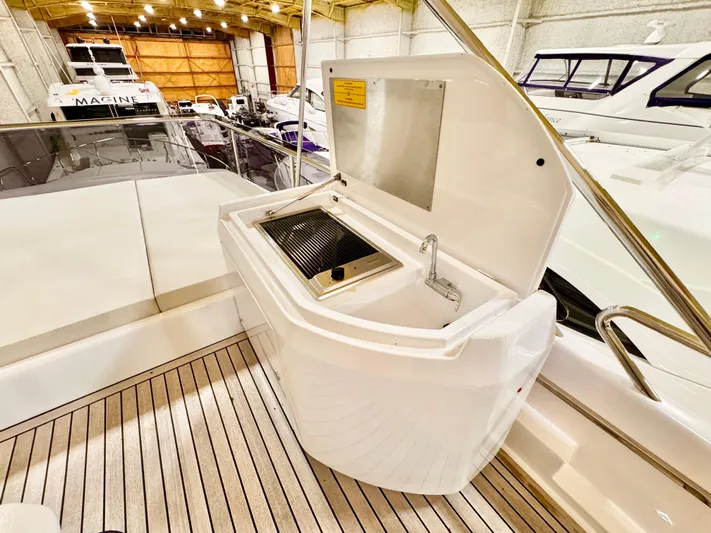 Time To Fly Yacht Photos Pics Outdoor grill on 2022 Ferretti Yachts 550, showcasing sleek design and functionality.