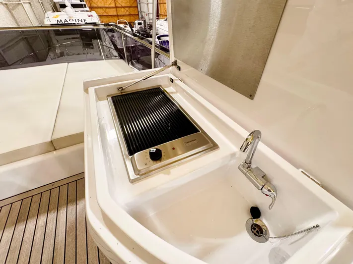 Time To Fly Yacht Photos Pics Outdoor sink and grill on 2022 Ferretti Yachts 550 deck.