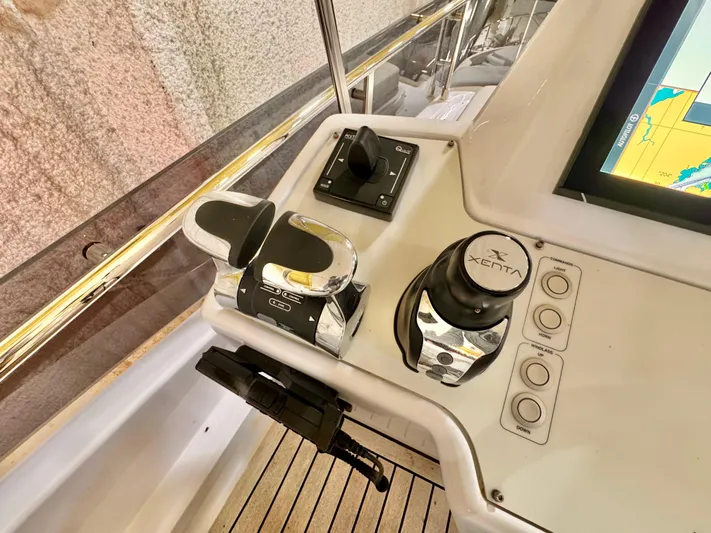 Time To Fly Yacht Photos Pics Control panel of 2022 Ferretti Yachts 550, featuring navigation and throttle controls.