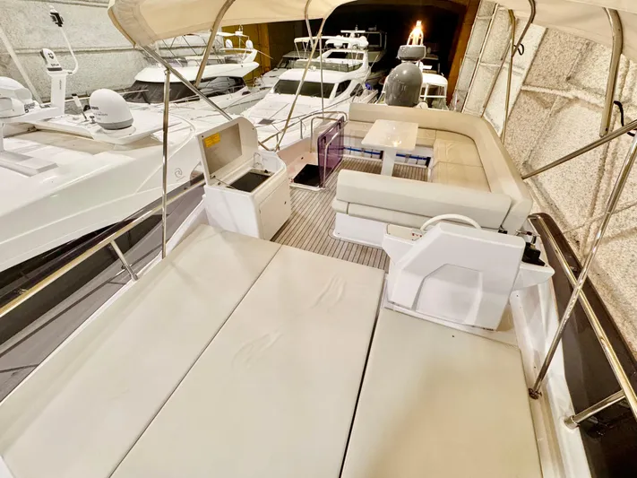 Time To Fly Yacht Photos Pics 2022 Ferretti Yachts 550 interior with spacious seating and modern design.