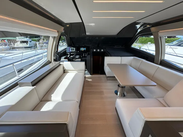 Time To Fly Yacht Photos Pics Luxurious interior of 2022 Ferretti Yachts 550 with elegant seating and modern design.