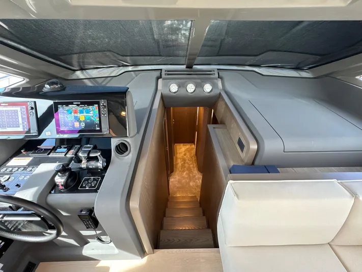 Time To Fly Yacht Photos Pics Helm station of 2022 Ferretti Yachts 550 with modern navigation equipment.
