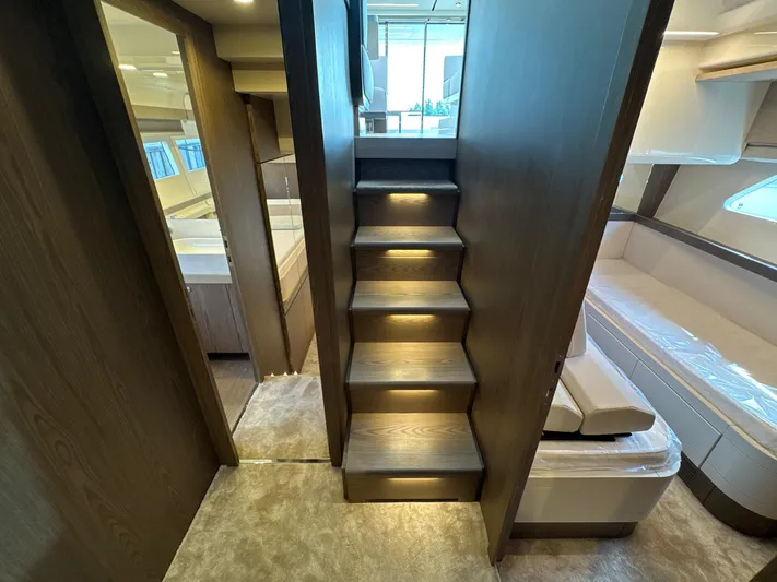 Time To Fly Yacht Photos Pics Interior of 2022 Ferretti Yachts 550, featuring elegant wooden stairs and modern design.
