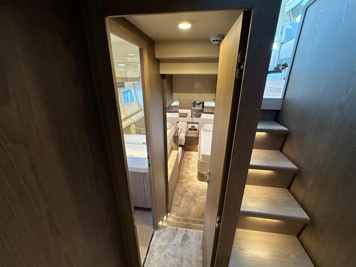 Time To Fly Yacht Photos Pics Luxurious interior of 2022 Ferretti Yachts 550, featuring modern design and elegant wood finishes.