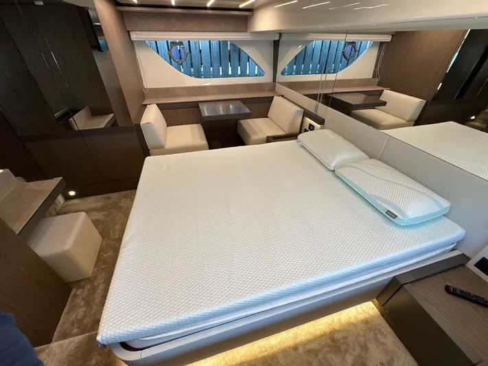 Time To Fly Yacht Photos Pics Luxurious interior of 2022 Ferretti Yachts 550 with modern bedroom and seating area.