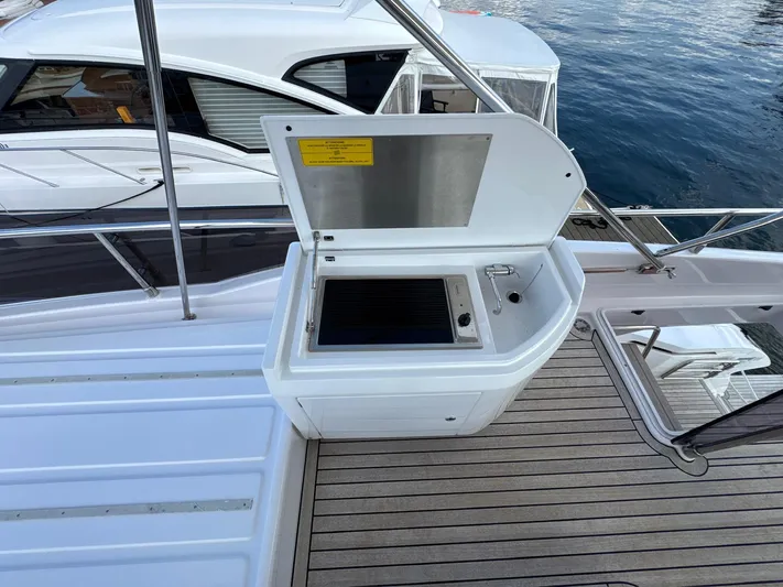 Time To Fly Yacht Photos Pics Outdoor kitchen on 2022 Ferretti Yachts 550, featuring a grill and sink.