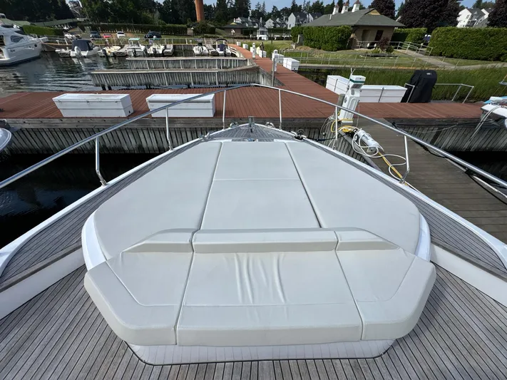 Time To Fly Yacht Photos Pics Luxury Ferretti Yachts 550, 2022 model, docked with spacious sunbathing area.
