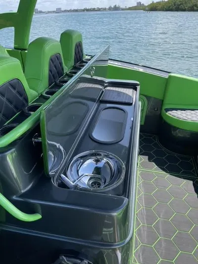  Yacht Photos Pics 2020 Midnight Express Open 43 boat interior with green accents and sleek design.