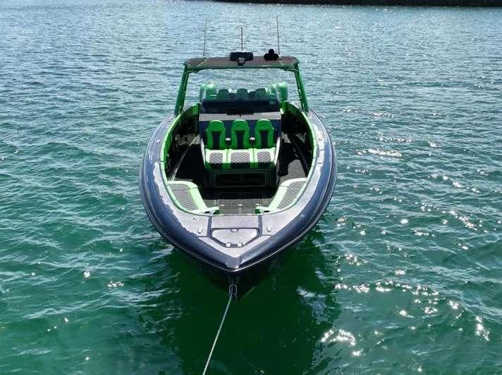  Yacht Photos Pics 2020 Midnight Express Open 43 boat on water, featuring green and black design.