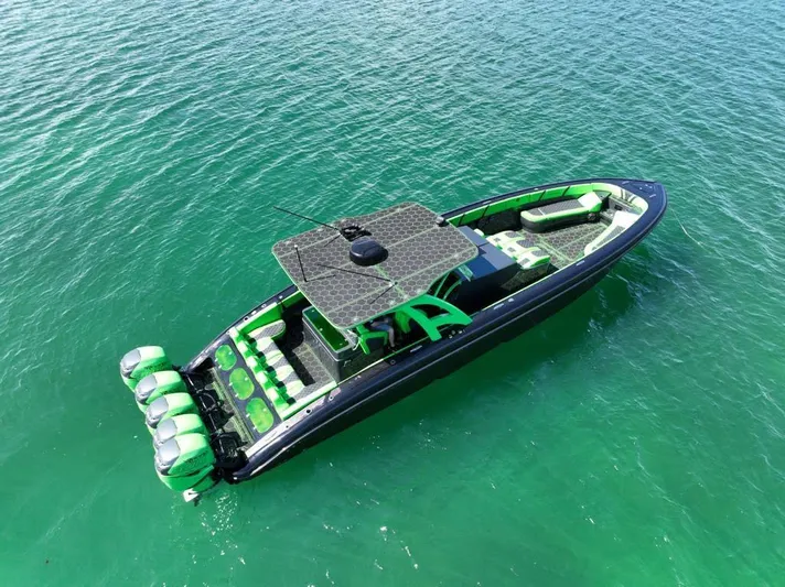 Yacht Photos Pics 2020 Midnight Express Open 43 boat with vibrant green accents on clear water.