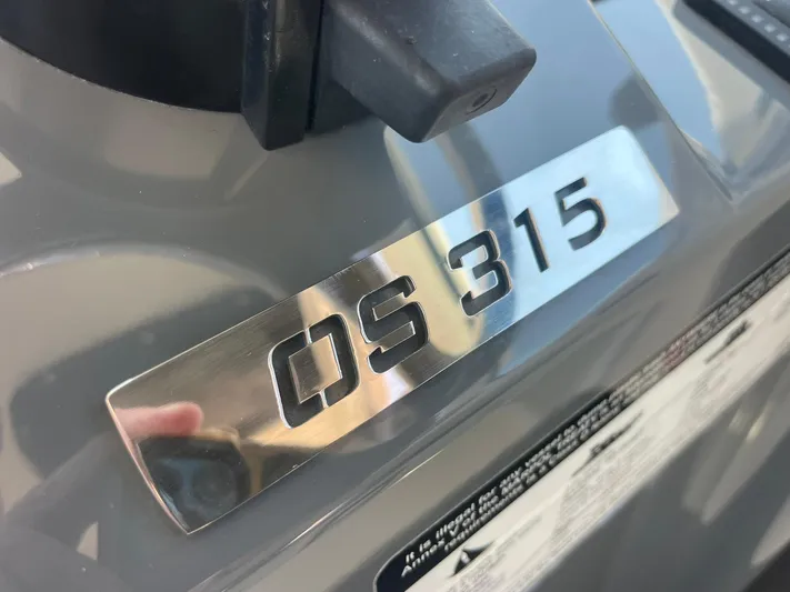  Yacht Photos Pics Chrome badge of 2012 Pursuit OS 315 Offshore boat.