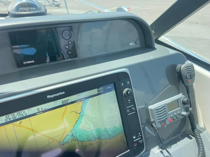  Yacht Photos Pics Dashboard of 2012 Pursuit OS 315 Offshore with navigation and communication equipment.