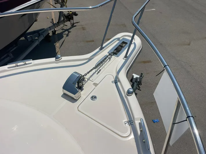  Yacht Photos Pics Bow of 2012 Pursuit OS 315 Offshore boat with anchor chain and railing.