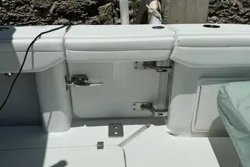  Yacht Photos Pics 2021 Yellowfin 39 boat interior detail with white seating and storage compartments.