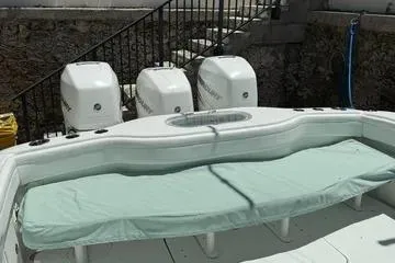  Yacht Photos Pics 2021 Yellowfin 39 boat with triple outboard engines and cushioned seating.