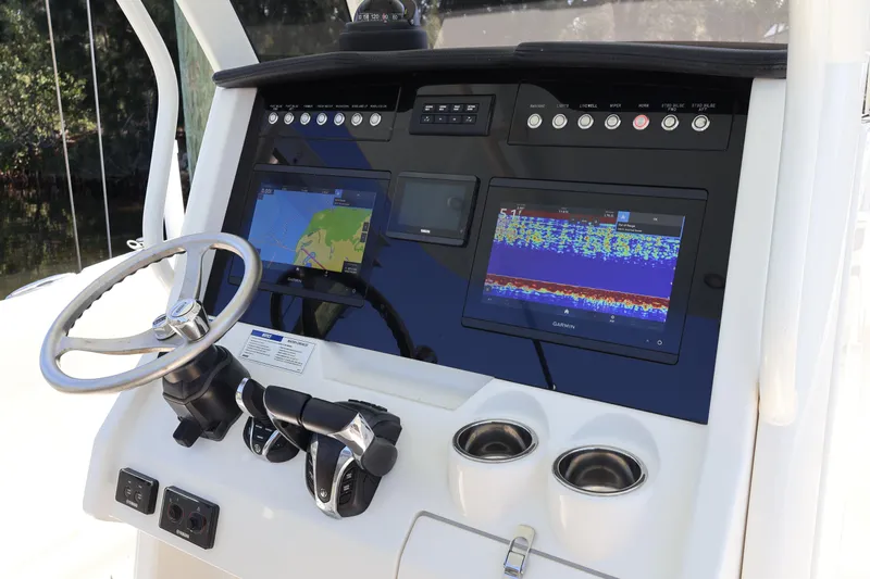  Yacht Photos Pics 2022 World Cat 280 CC-X dashboard with Garmin navigation and control systems.