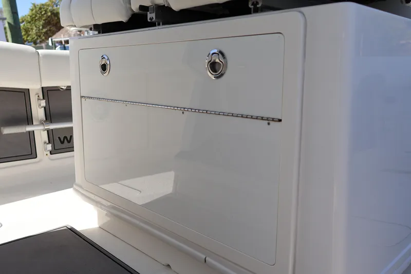  Yacht Photos Pics 2022 World Cat 280 CC-X boat storage compartment with sleek design and secure latches.
