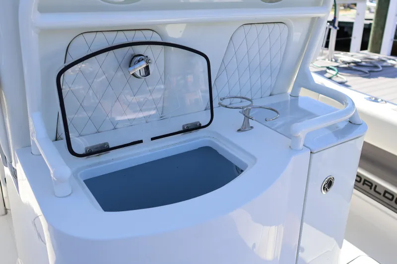  Yacht Photos Pics 2022 World Cat 280 CC-X boat with open storage compartment and cup holders.