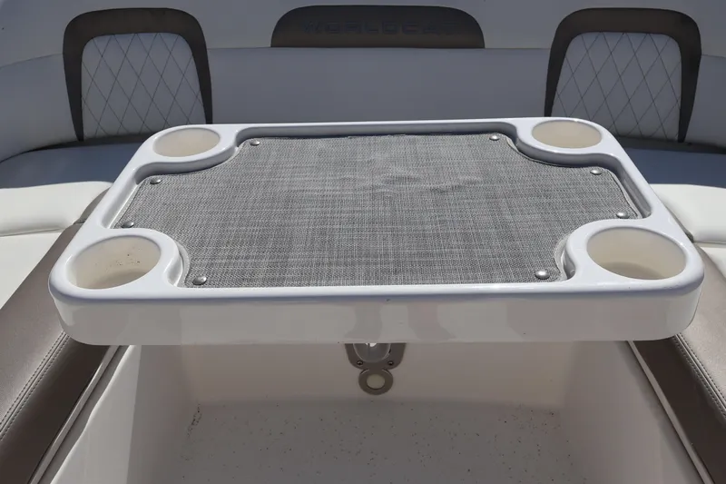  Yacht Photos Pics 2022 World Cat 280 CC-X boat table with cup holders and mesh surface.