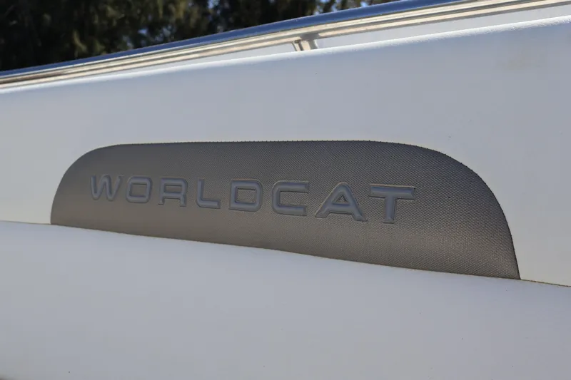  Yacht Photos Pics 2022 World Cat 280 CC-X boat logo detail on white surface.