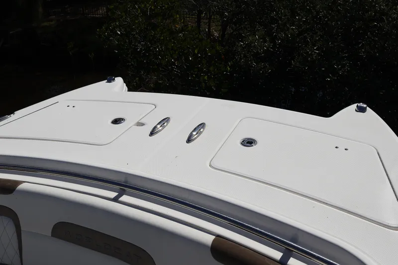  Yacht Photos Pics 2022 World Cat 280 CC-X boat deck with storage compartments and sleek design.