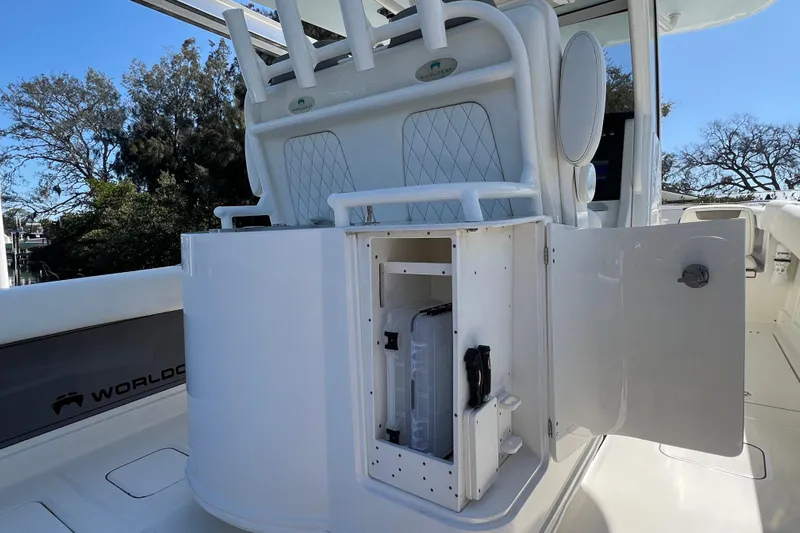  Yacht Photos Pics 2022 World Cat 280 CC-X boat interior with open storage compartment and rod holders.