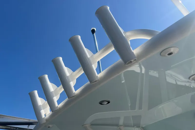  Yacht Photos Pics 2022 World Cat 280 CC-X boat with rod holders against clear blue sky.