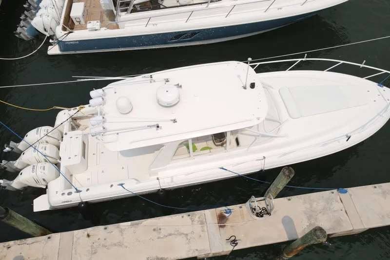  Yacht Photos Pics Aerial view of a 2010 Intrepid 390 Sport Yacht docked at a marina.