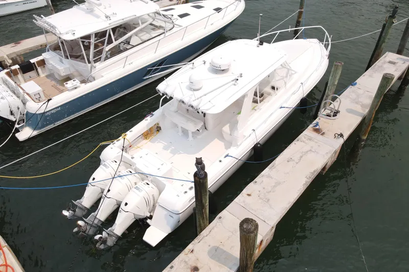  Yacht Photos Pics 2010 Intrepid 390 Sport Yacht docked with triple outboard engines.