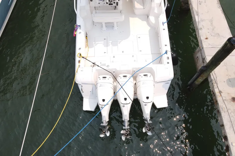  Yacht Photos Pics Overhead view of a 2010 Intrepid 390 Sport Yacht docked with triple outboard engines.