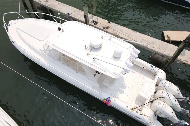  Yacht Photos Pics 2010 Intrepid 390 Sport Yacht docked, aerial view showcasing sleek design and triple engines.