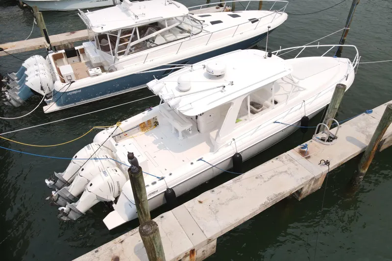  Yacht Photos Pics 2010 Intrepid 390 Sport Yacht docked with triple outboard engines.