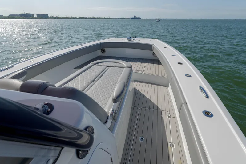 Outnumbered Yacht Photos Pics Freeman 37VH 2020 boat on calm water, featuring spacious deck and seating.
