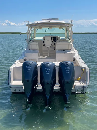  Yacht Photos Pics 2022 Grady-White Express 370 boat with triple 425 V8 engines on calm water.