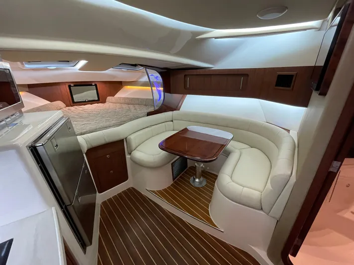 Yacht Photos Pics Luxurious interior of 2022 Grady-White Express 370 boat with seating and table.