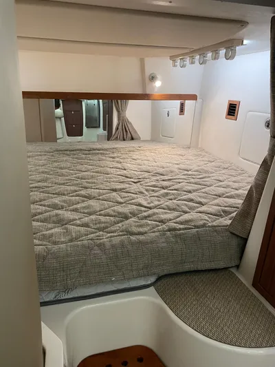  Yacht Photos Pics 2022 Grady-White Express 370 cabin interior with cozy bed and modern design.