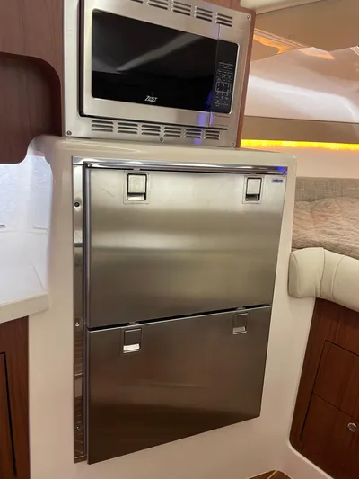  Yacht Photos Pics 2022 Grady-White Express 370 interior with stainless steel appliances and microwave.