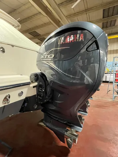  Yacht Photos Pics Yamaha XTO outboard motor on 2022 Grady-White Express 370 boat in a workshop.
