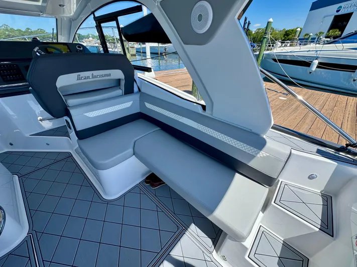  Yacht Photos Pics 2025 Beneteau Gran Turismo 36 interior with sleek seating and modern design.